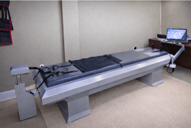 VAX-D vertebral axial decompression therapy table at City Integrative Rehabilitation West Hills used for non-surgical spinal decompression treatment for car accident patients